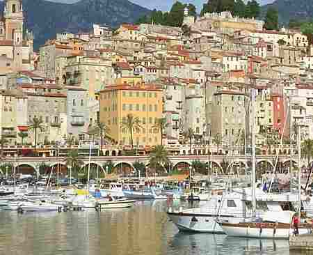 Menton harbour with the old town and the Alps in the background