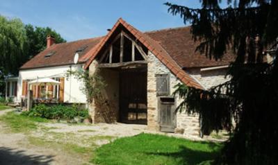 Two cottages with large barn in between