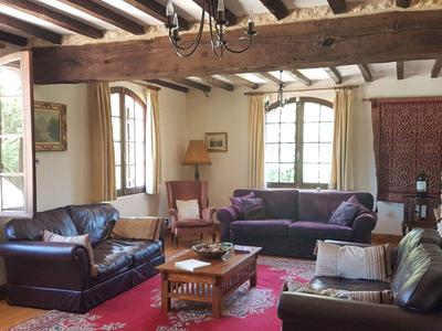 Large L shaped lounge dining room with wood burner