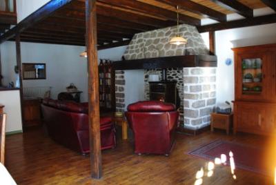 Interior showing fireplace, beams and floor
